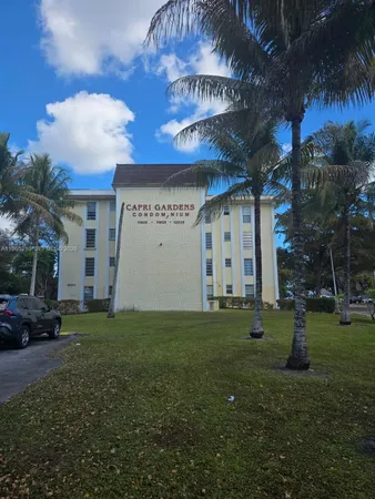 a view of a building with a yard