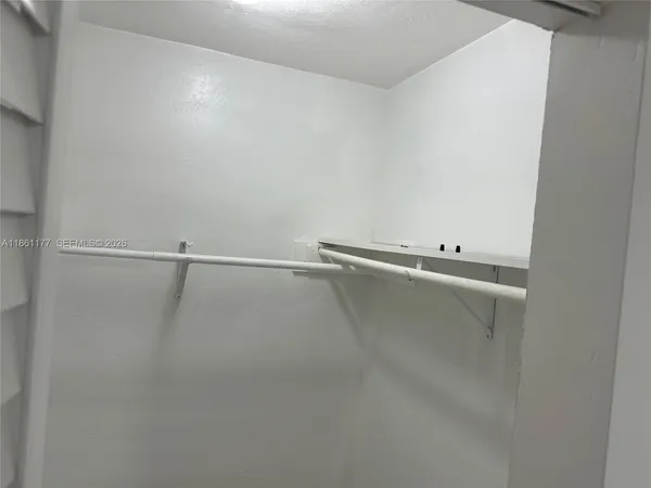 a view of a room with racks on the wall