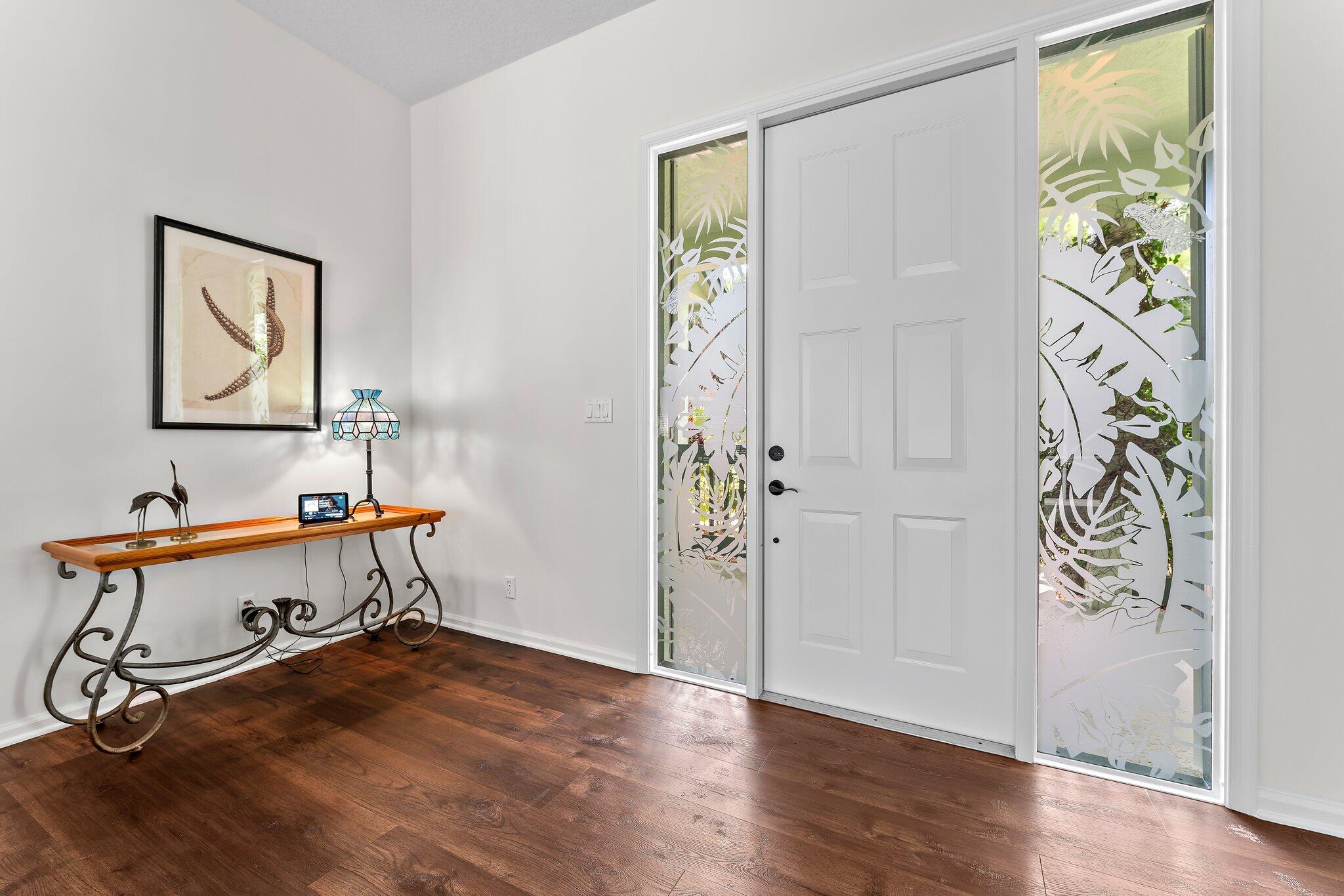 15784 Alexander Run Jupiter, FL 33478 - Photo 5 of 44 a view of a workspace with wooden floor and a window