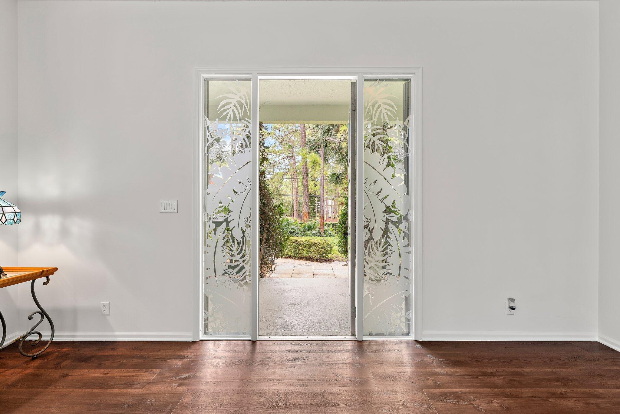 15784 Alexander Run Jupiter, FL 33478 - Photo 6 of 44 a view of an entryway with wooden floor