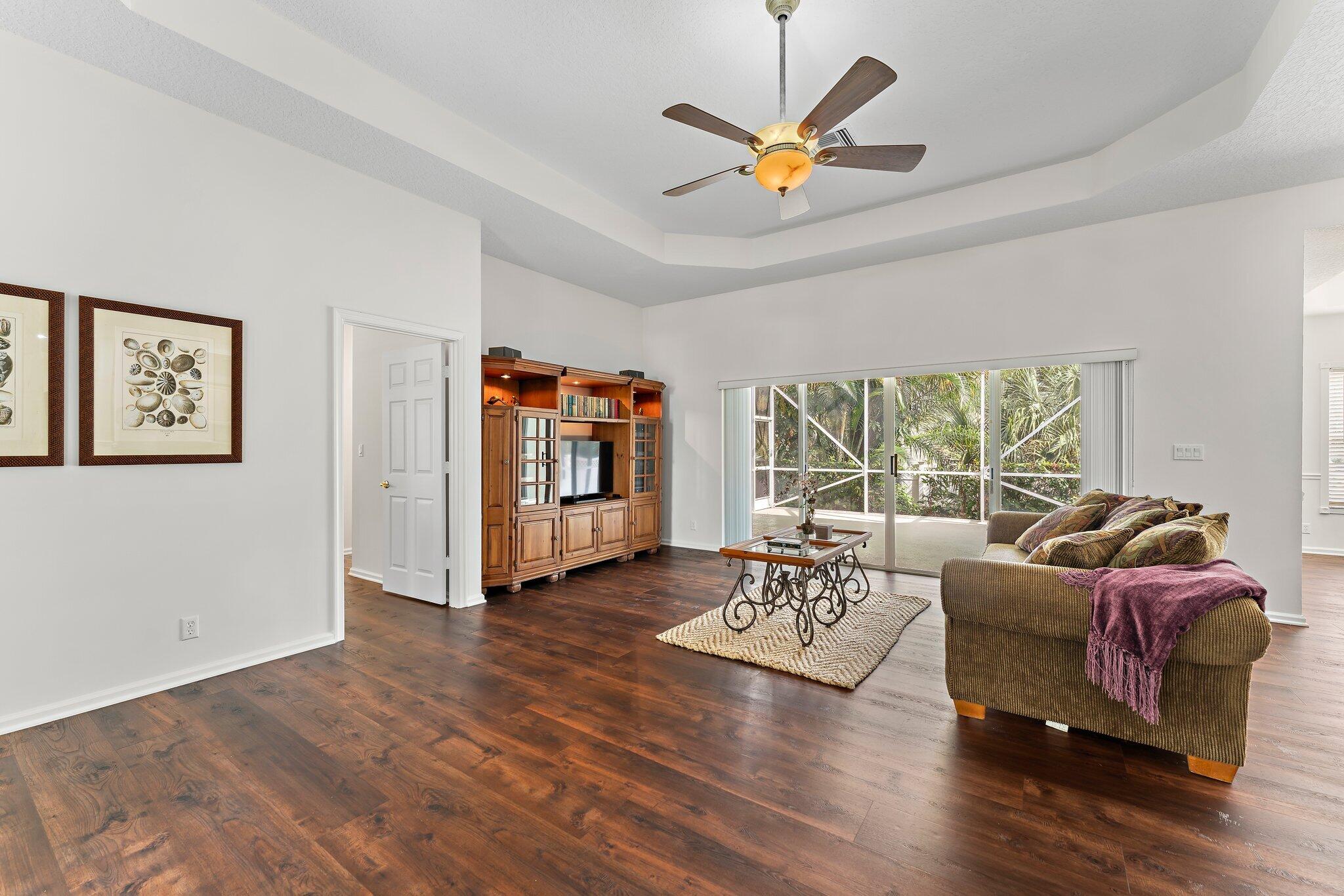 15784 Alexander Run Jupiter, FL 33478 - Photo 7 of 44 a living room with furniture fireplace and a large window