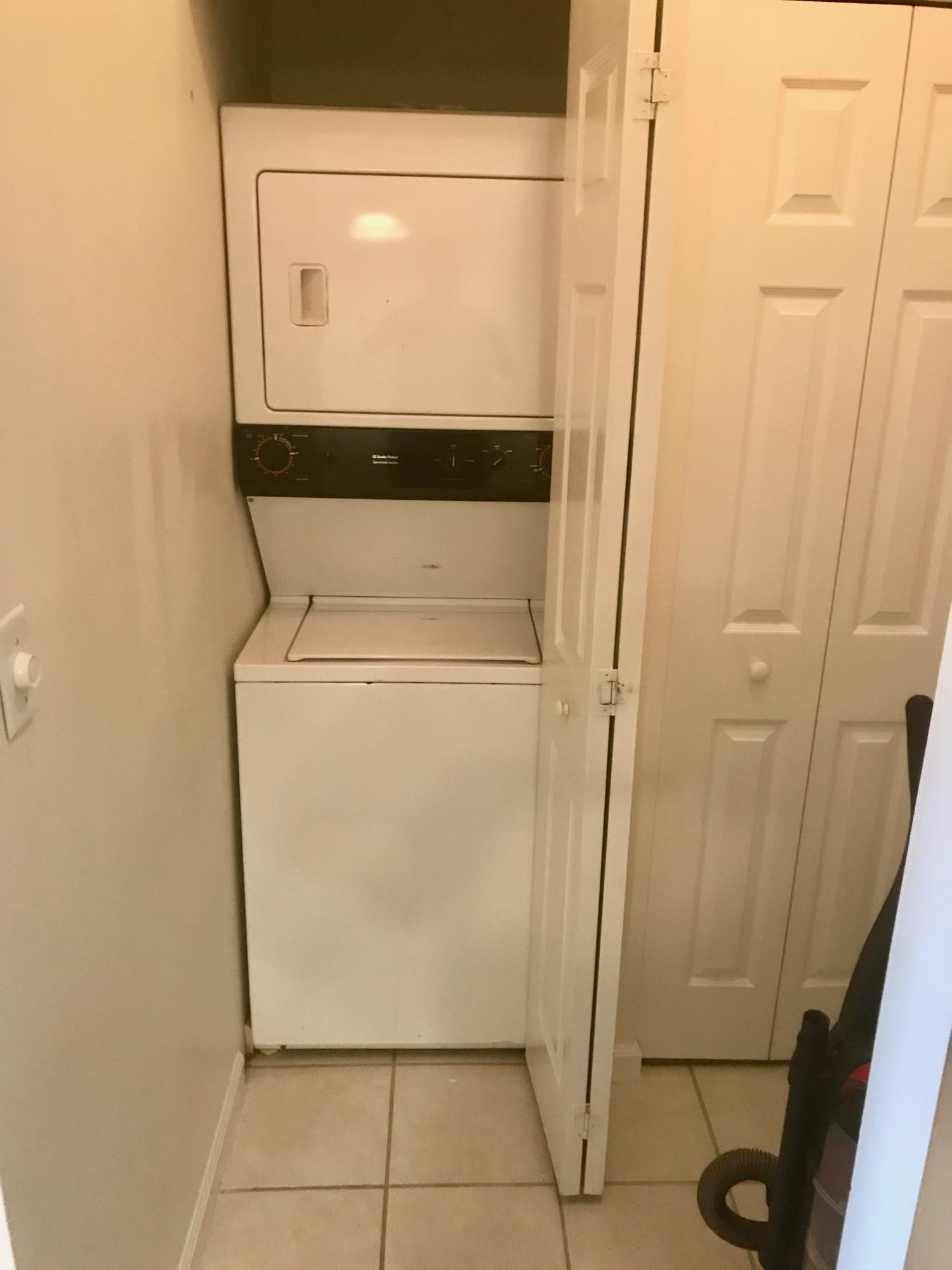 34 Heron's Watch Way, Unit 3203 Santa Rosa Beach, FL 32459 - Photo 11 of 12 a utility room with wooden floor washer and dryer