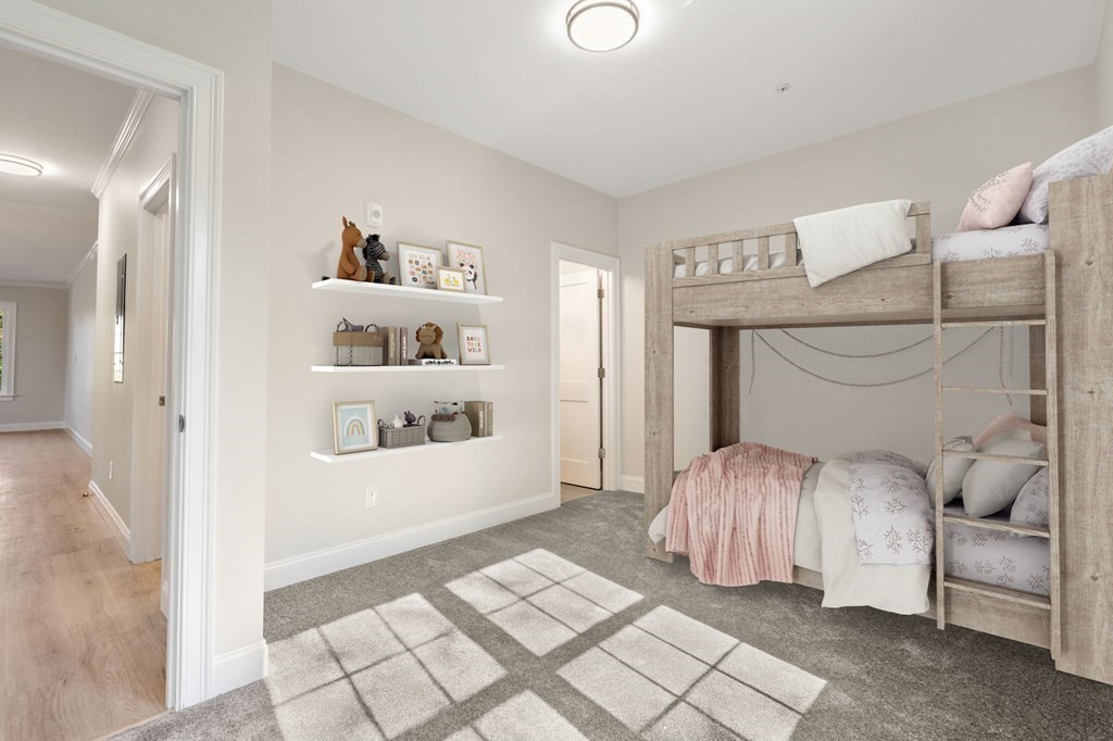 242 Main Street, Unit 203 Millis, MA 02054 - Photo 11 of 18 a bedroom with a bed and a window