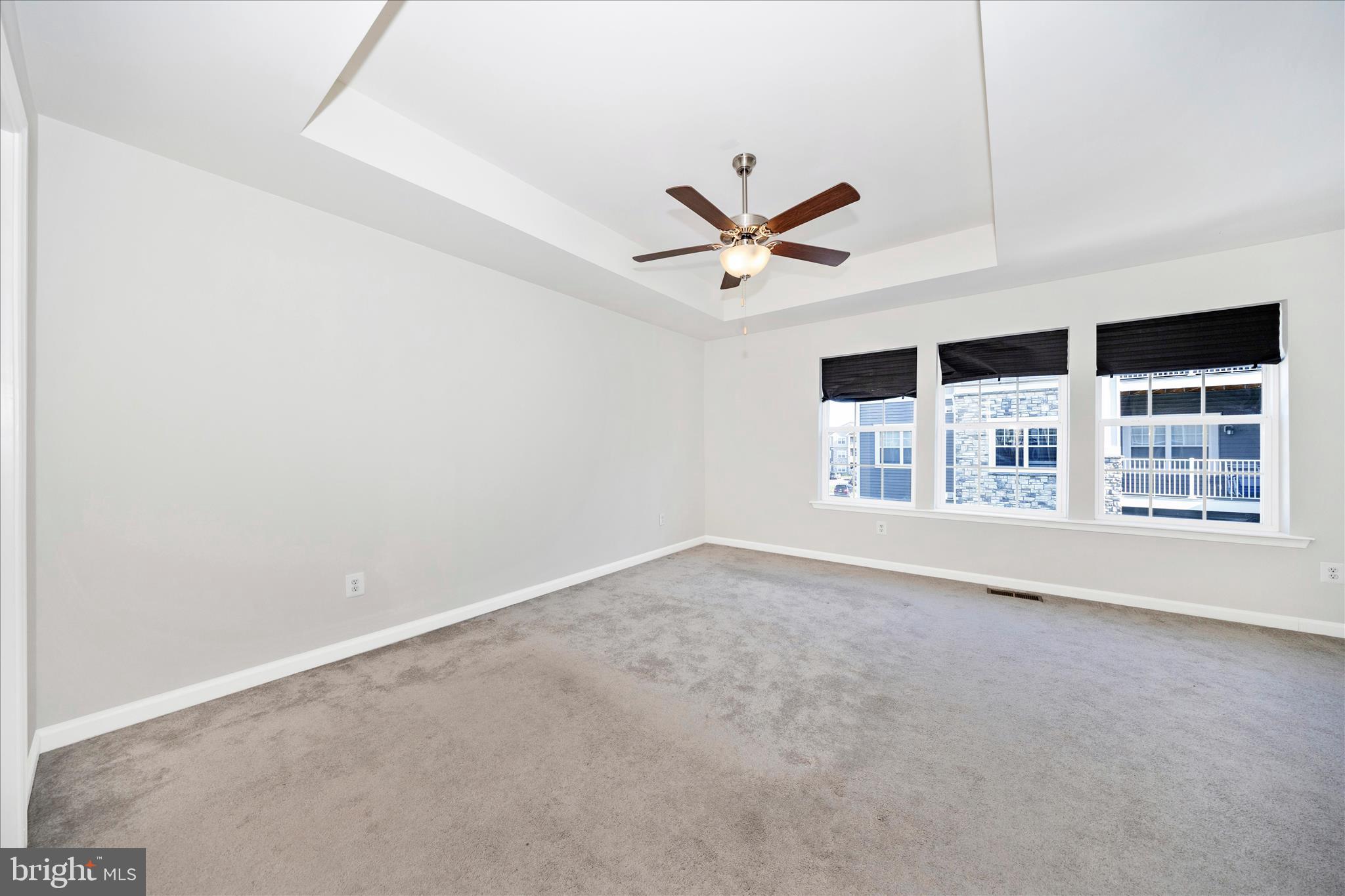 203 Charterhouse Street Falling Waters, WV 25419 - Photo 22 of 46 an empty room with a empty space and windows