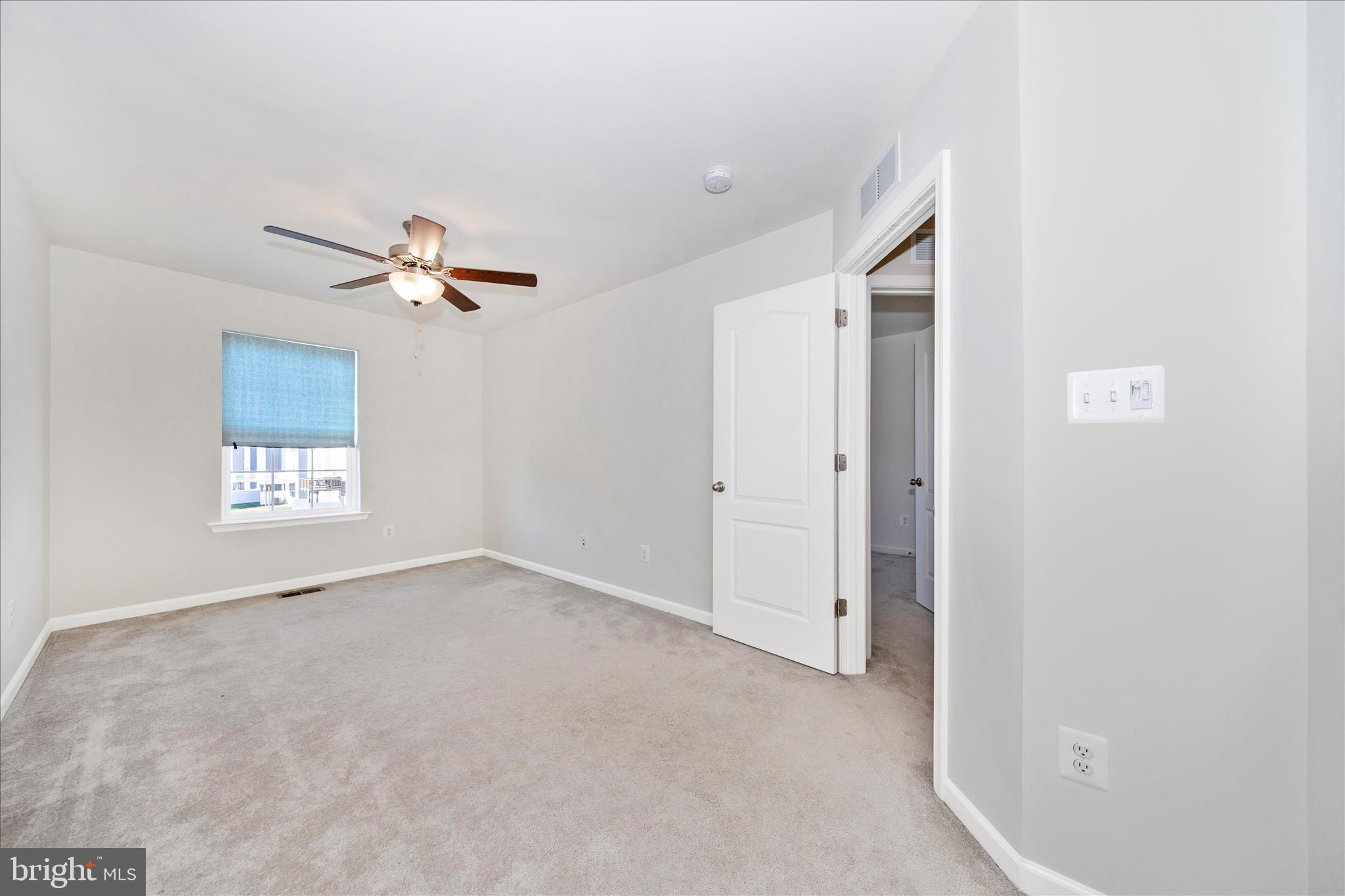 203 Charterhouse Street Falling Waters, WV 25419 - Photo 27 of 46 an empty room with windows and fan