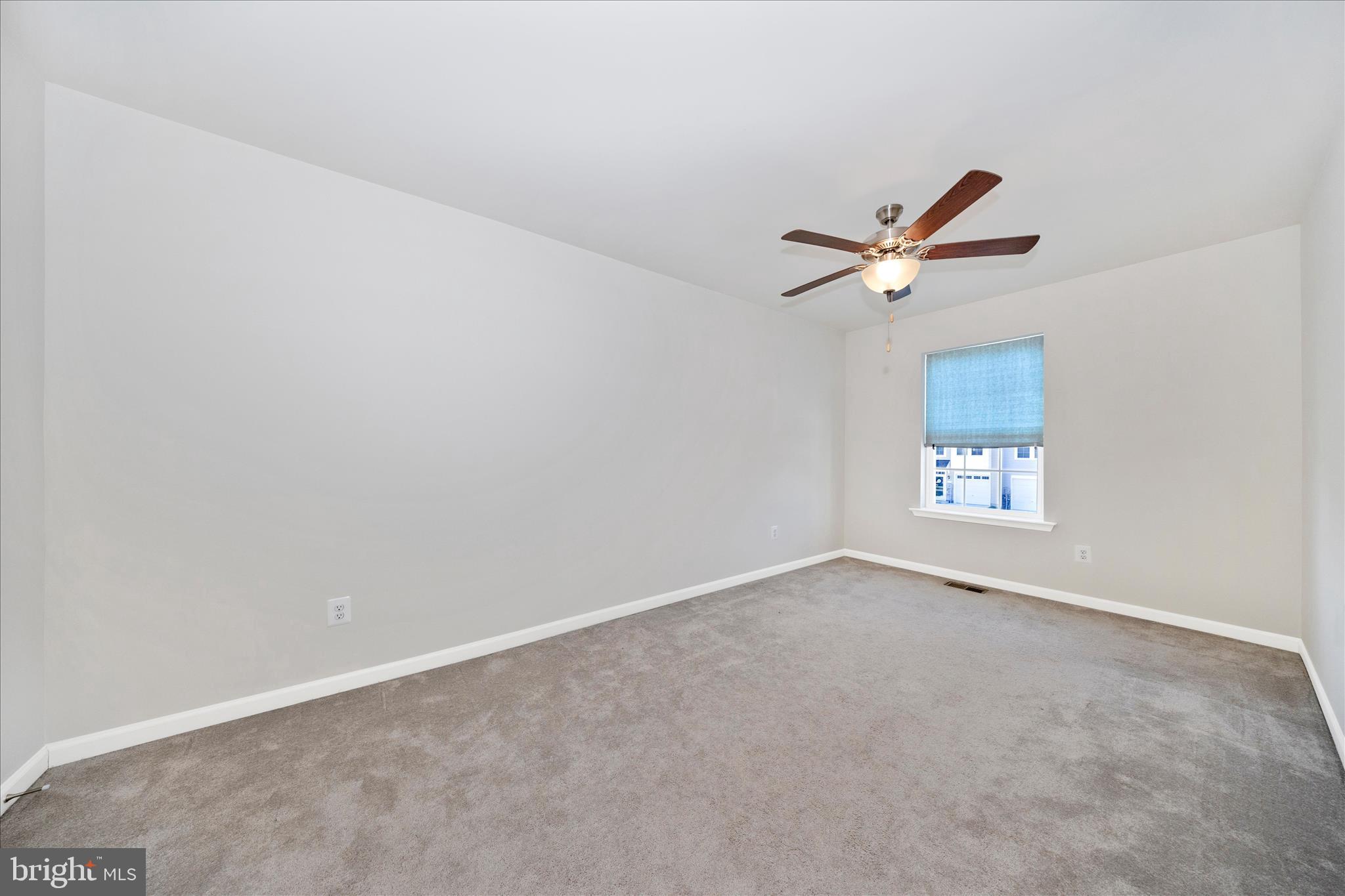 203 Charterhouse Street Falling Waters, WV 25419 - Photo 28 of 46 an empty room with a window and a fan