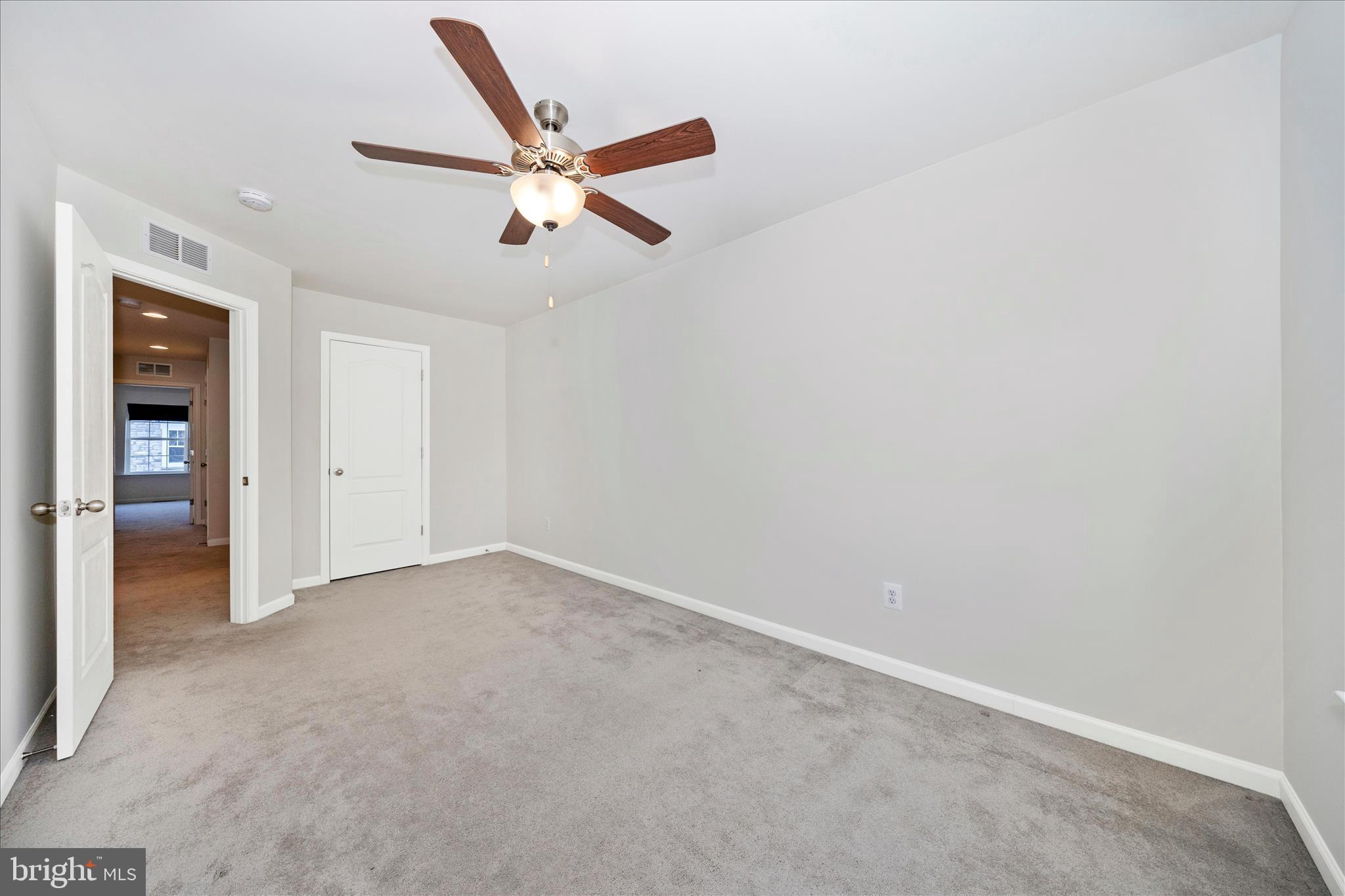 203 Charterhouse Street Falling Waters, WV 25419 - Photo 29 of 46 an empty room with closet and windows