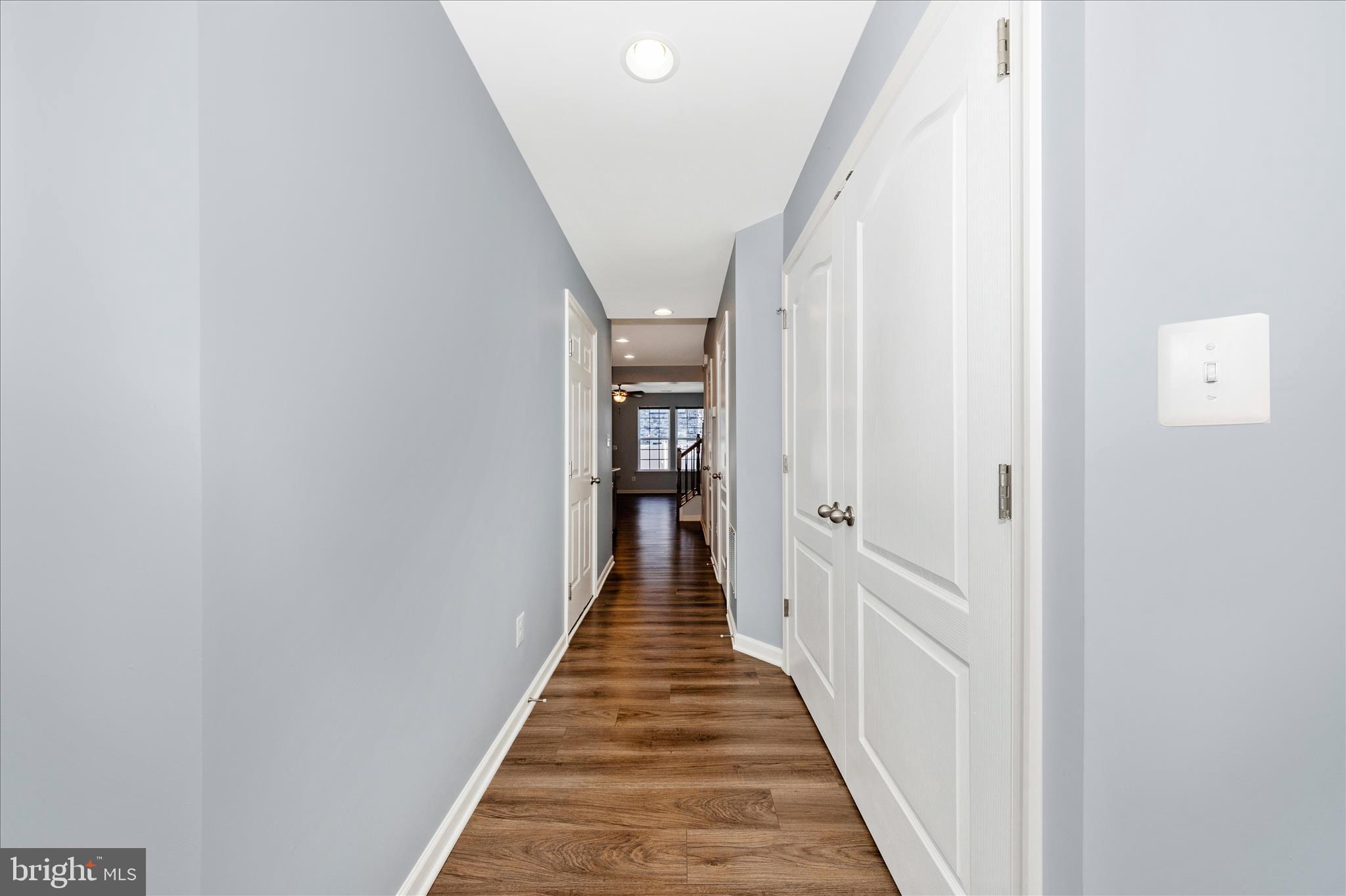 203 Charterhouse Street Falling Waters, WV 25419 - Photo 3 of 46 a view of a hallway with wooden floor and staircase