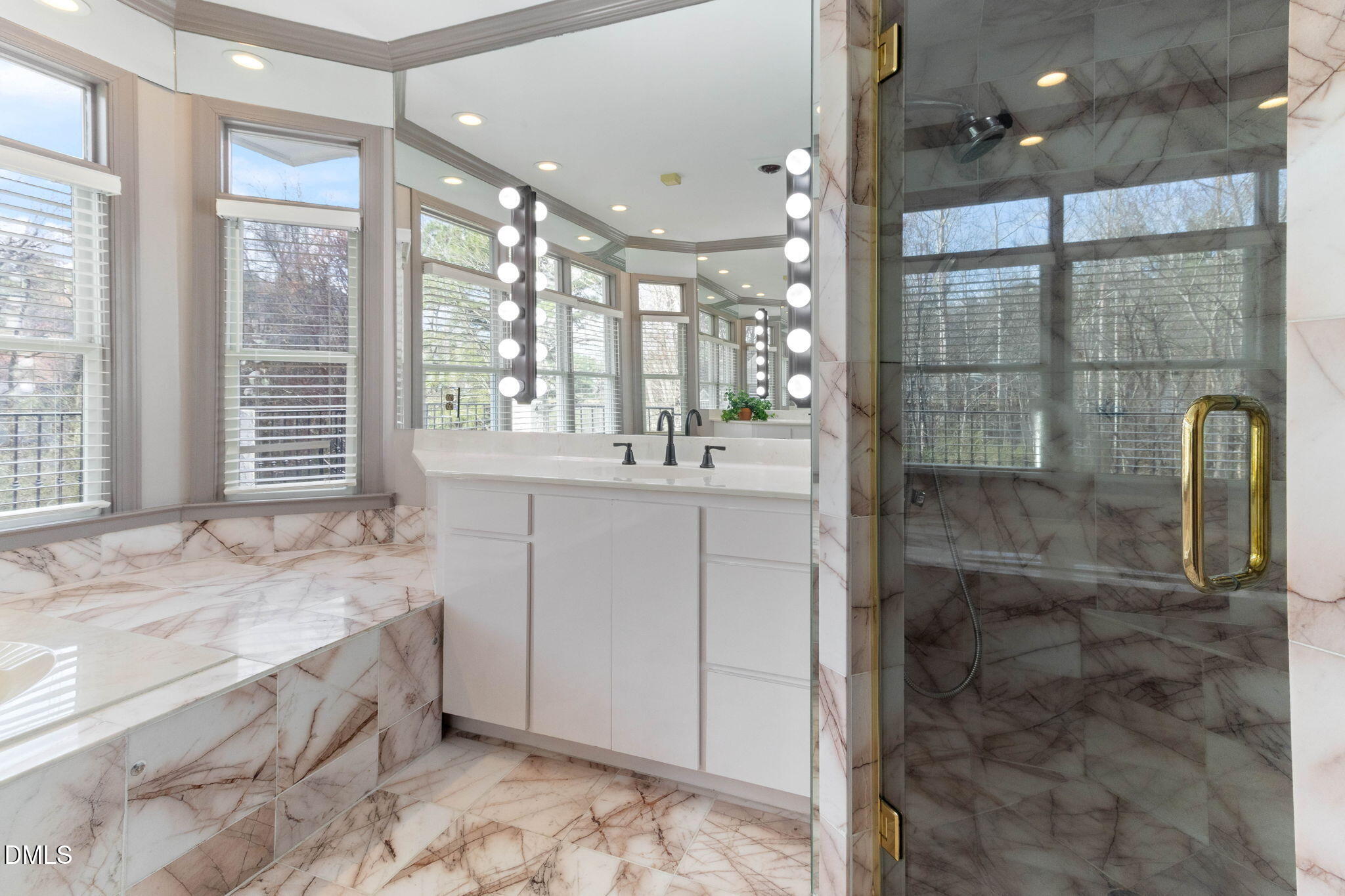 4205 Swarthmore Road Durham, NC 27707 - Photo 6 of 86 a bathroom with a double vanity sink and large mirror