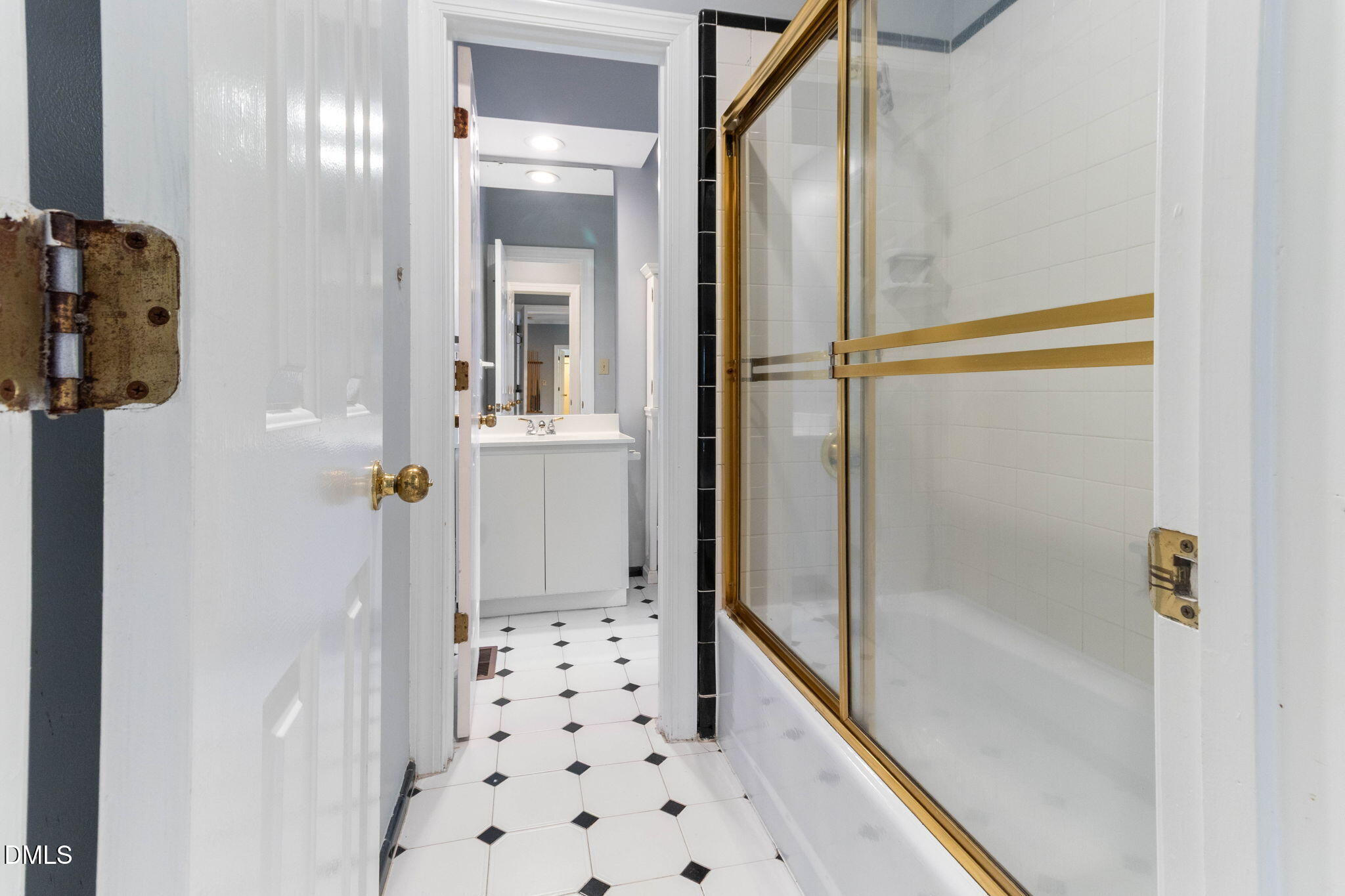 4205 Swarthmore Road Durham, NC 27707 - Photo 13 of 86 a bathroom with a shower and a glass door