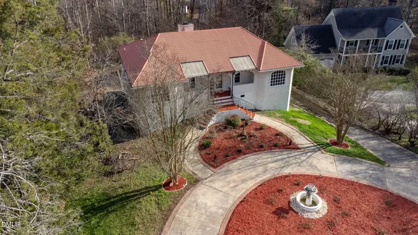 an aerial view of a house with outdoor space