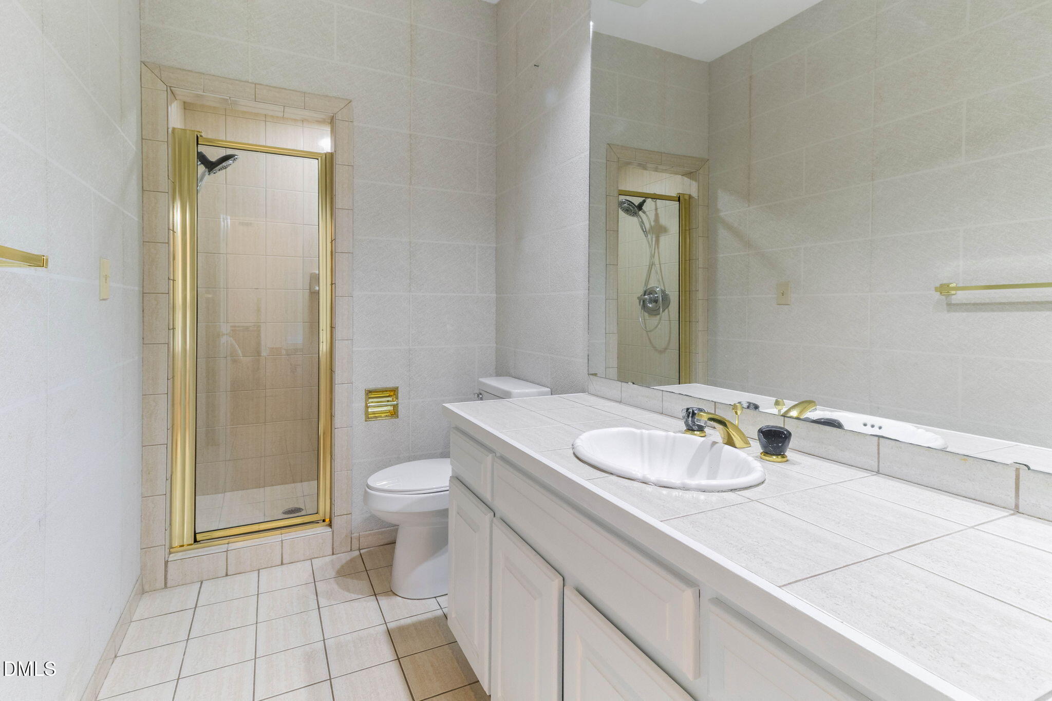 4205 Swarthmore Road Durham, NC 27707 - Photo 32 of 86 a bathroom with a sink a toilet and shower