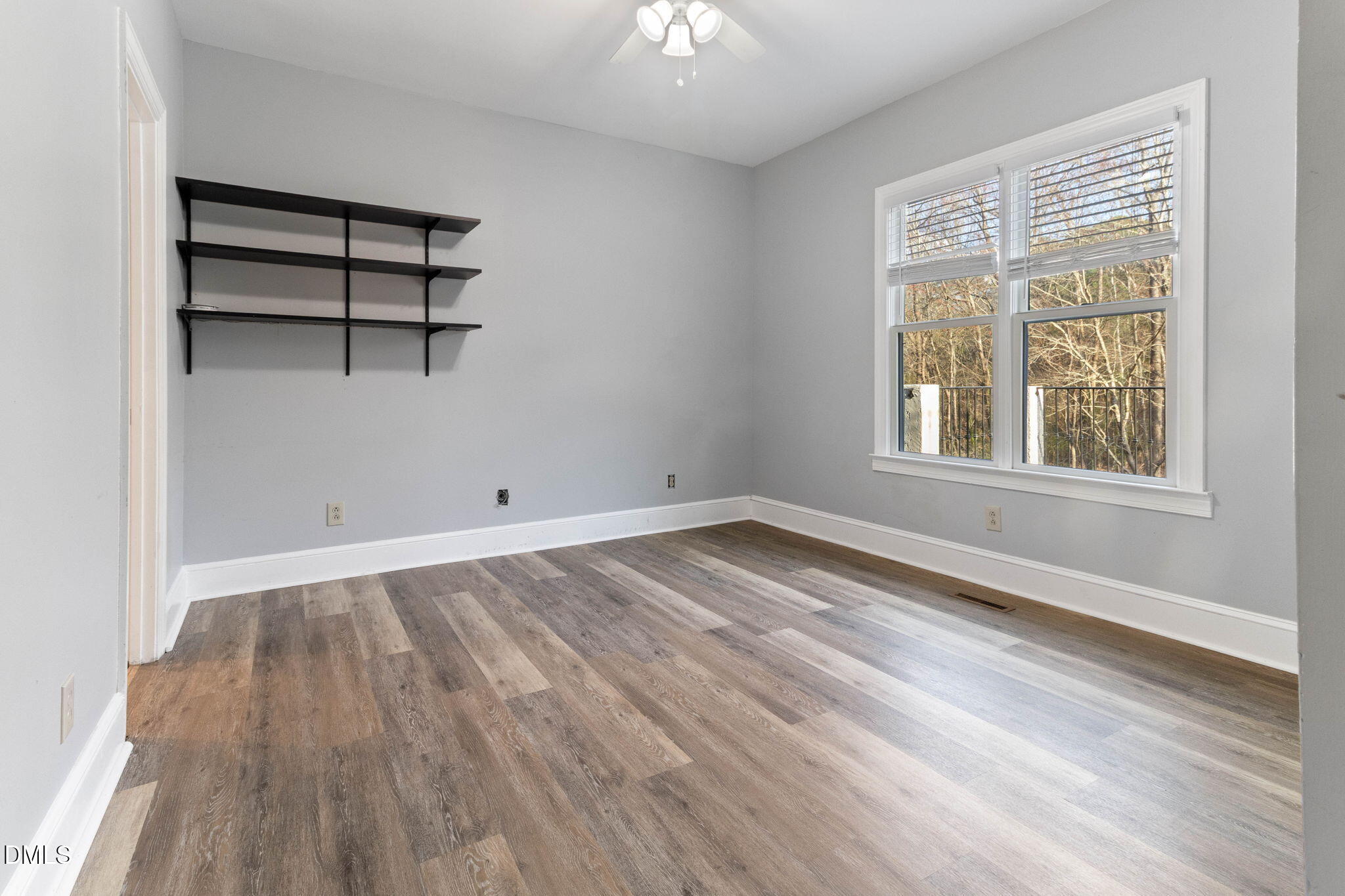 4205 Swarthmore Road Durham, NC 27707 - Photo 52 of 86 an empty room with wooden floor closet and windows