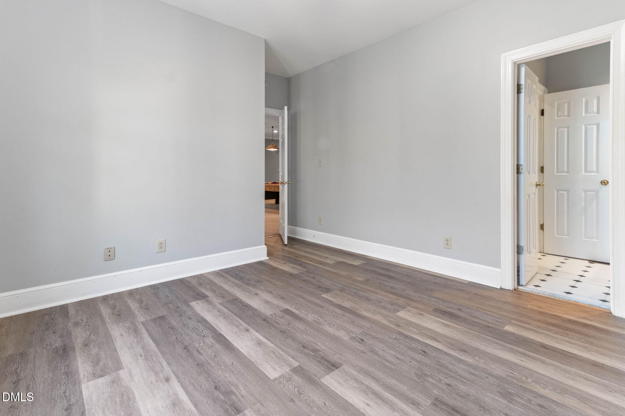 4205 Swarthmore Road Durham, NC 27707 - Photo 53 of 86 a view of an empty room with wooden floor and closet