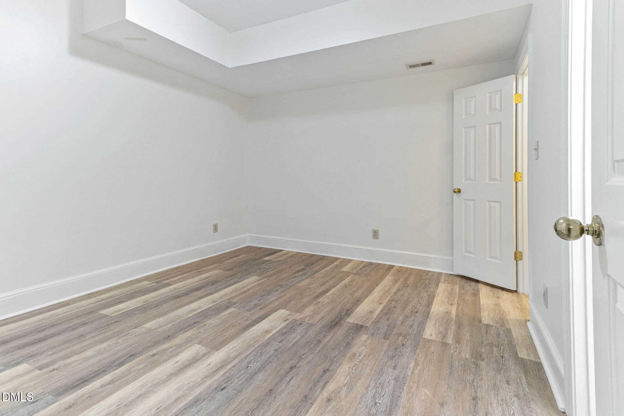4205 Swarthmore Road Durham, NC 27707 - Photo 62 of 86 a view of an empty room with wooden floor