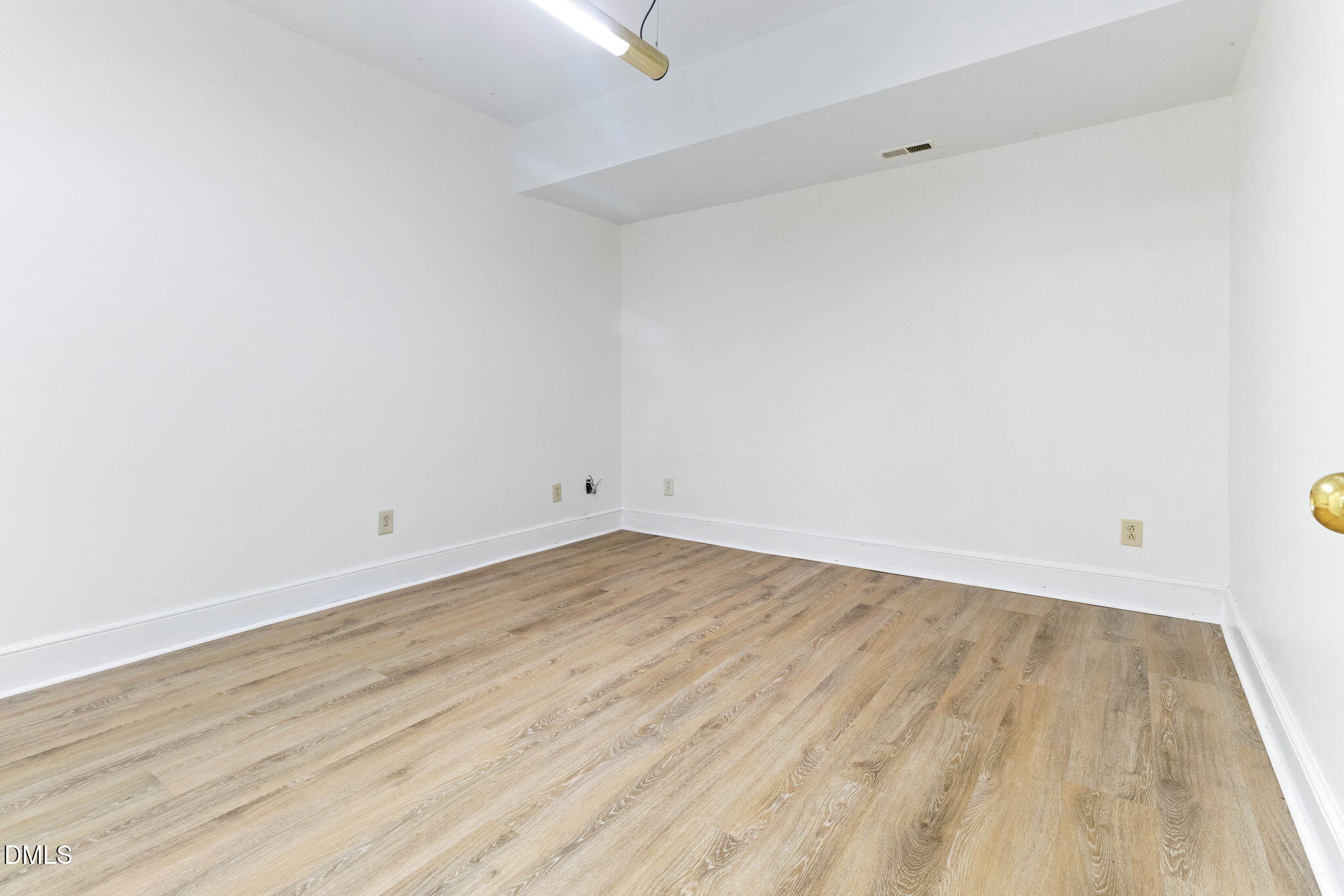 4205 Swarthmore Road Durham, NC 27707 - Photo 66 of 86 a view of empty room with wooden floor