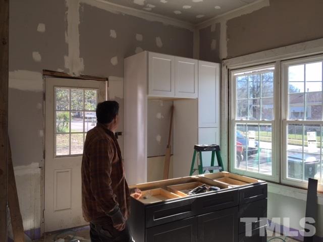 202 Heck Street Raleigh, NC 27601 - Photo 15 of 24 a room with furniture and a window