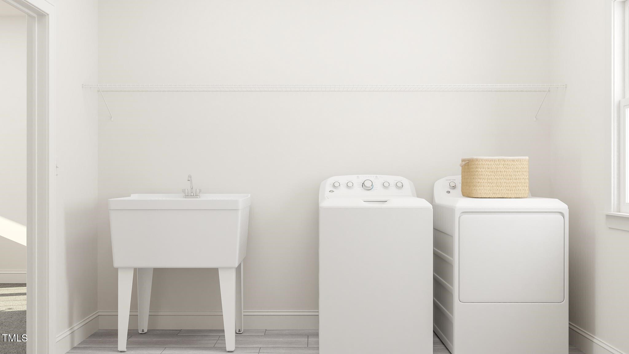 356 Calvander Lane Apex, NC 27539 - Photo 18 of 38 a utility room with dryer and washer
