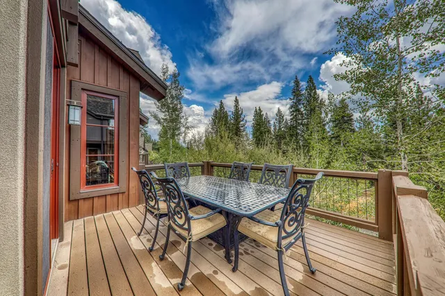 a view of balcony with furniture and wooden floor