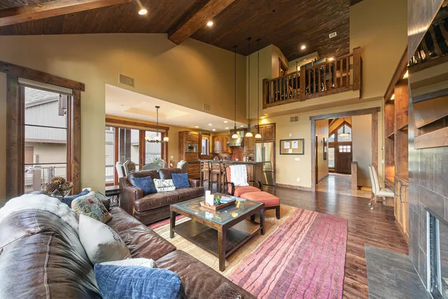 a living room with furniture and a table