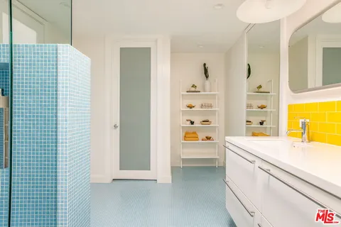 a spacious bedroom with a bed and a window