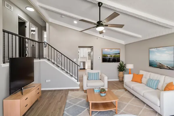 a living room with furniture and a flat screen tv