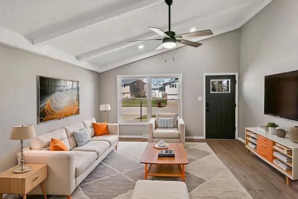 a living room with furniture and a flat screen tv