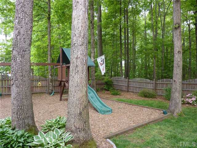 9405 Stone Mountain Road Raleigh, NC 27613 - Photo 11 of 12 Great playarea for children in the fenced back yard.