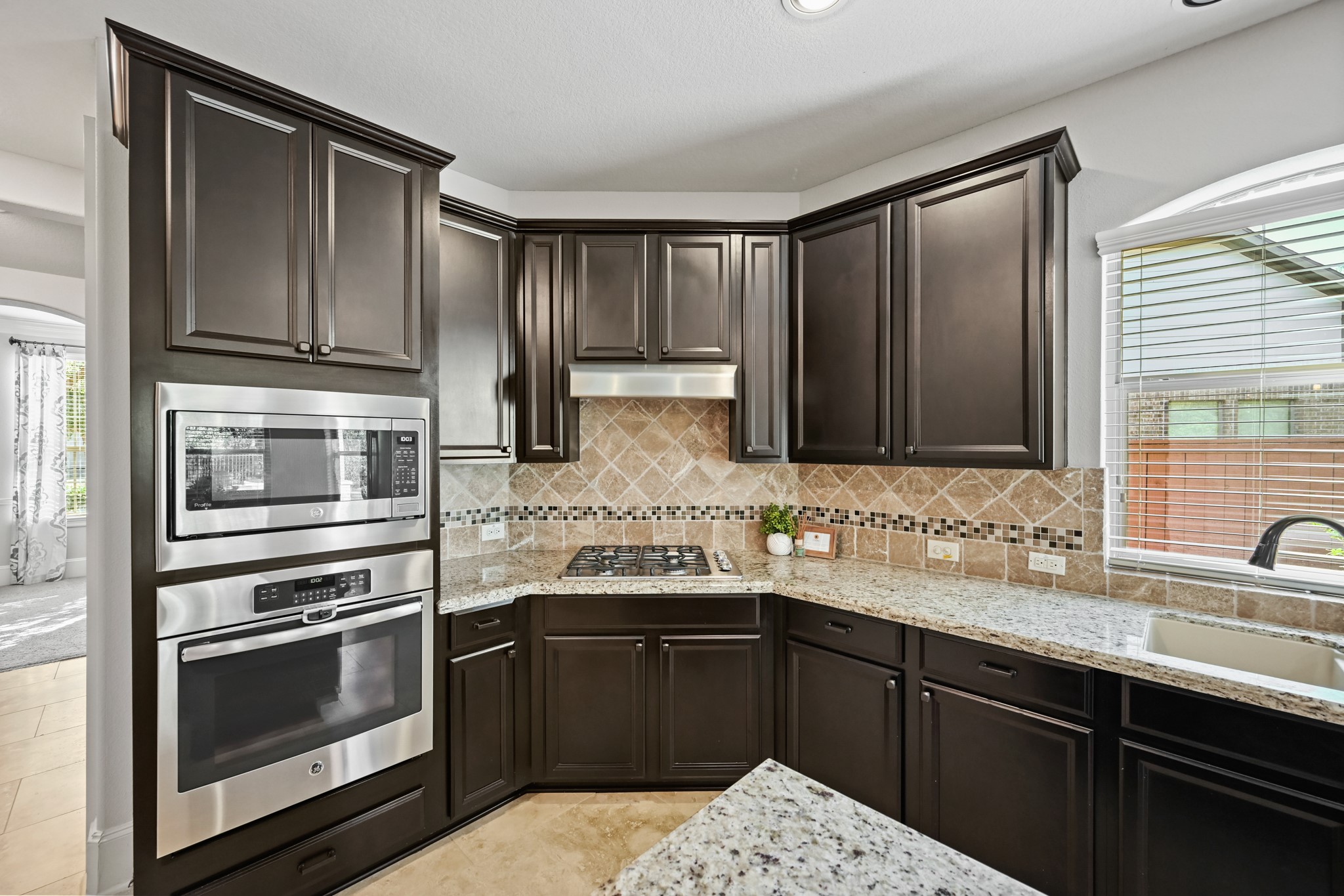 25202 Quiet Ledge Porter, TX 77365 - Photo 13 of 49 a kitchen with a sink stove and microwave