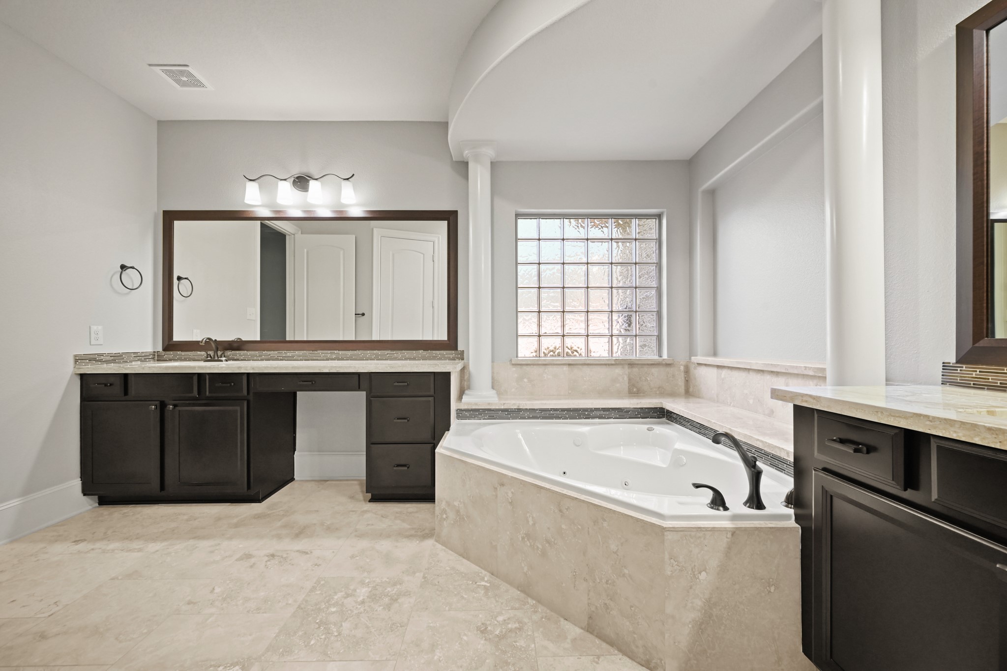 25202 Quiet Ledge Porter, TX 77365 - Photo 19 of 49 a bathroom with a tub sink and mirror