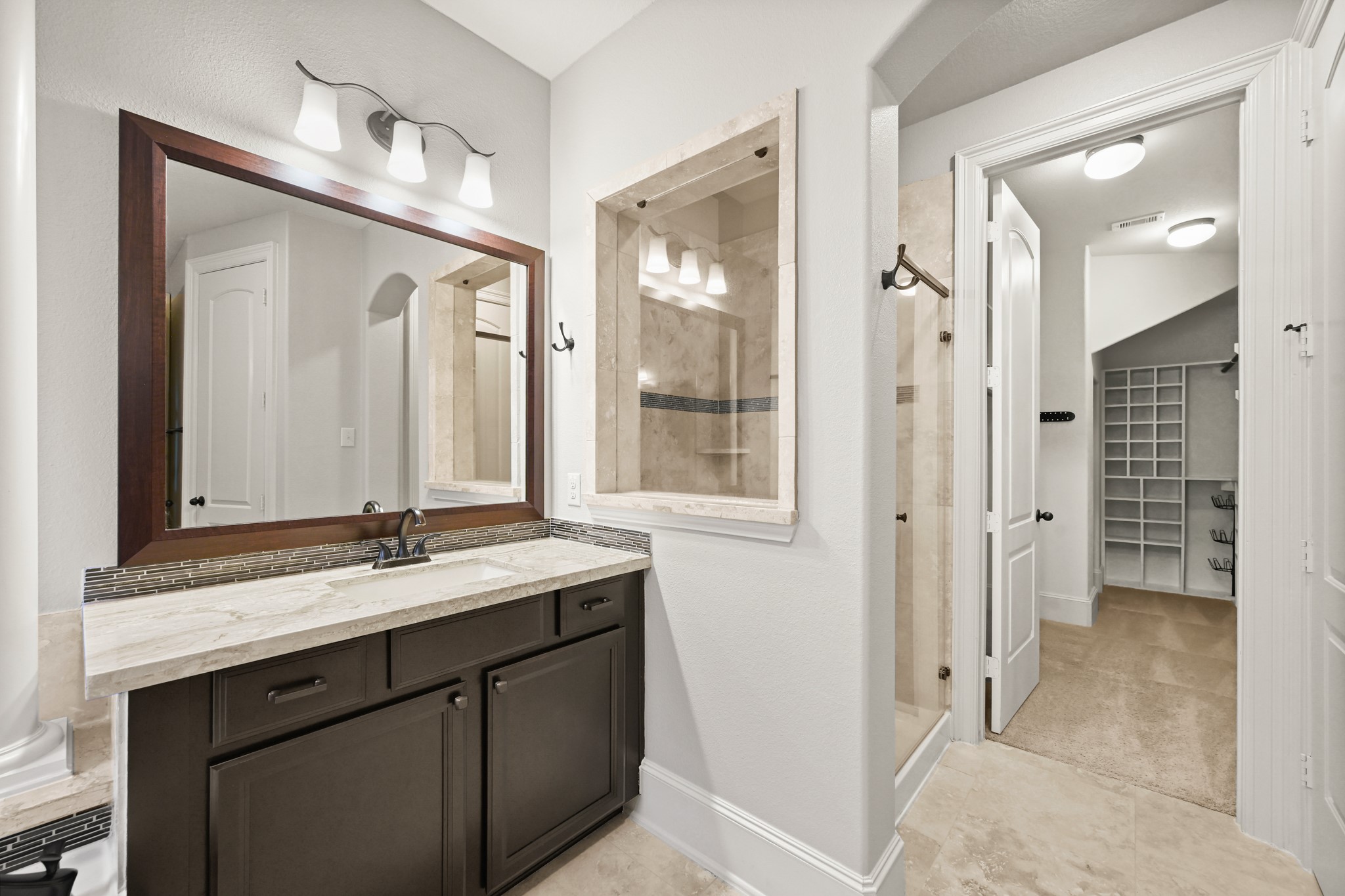 25202 Quiet Ledge Porter, TX 77365 - Photo 20 of 49 a bathroom with a double vanity sink mirror and double