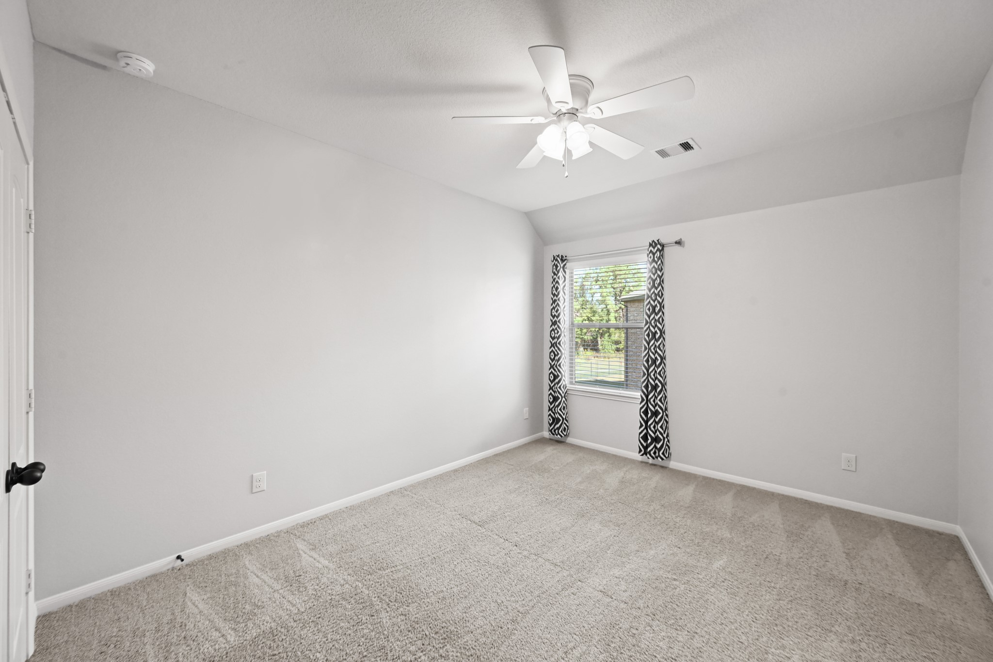 25202 Quiet Ledge Porter, TX 77365 - Photo 30 of 49 an empty room with windows and fan