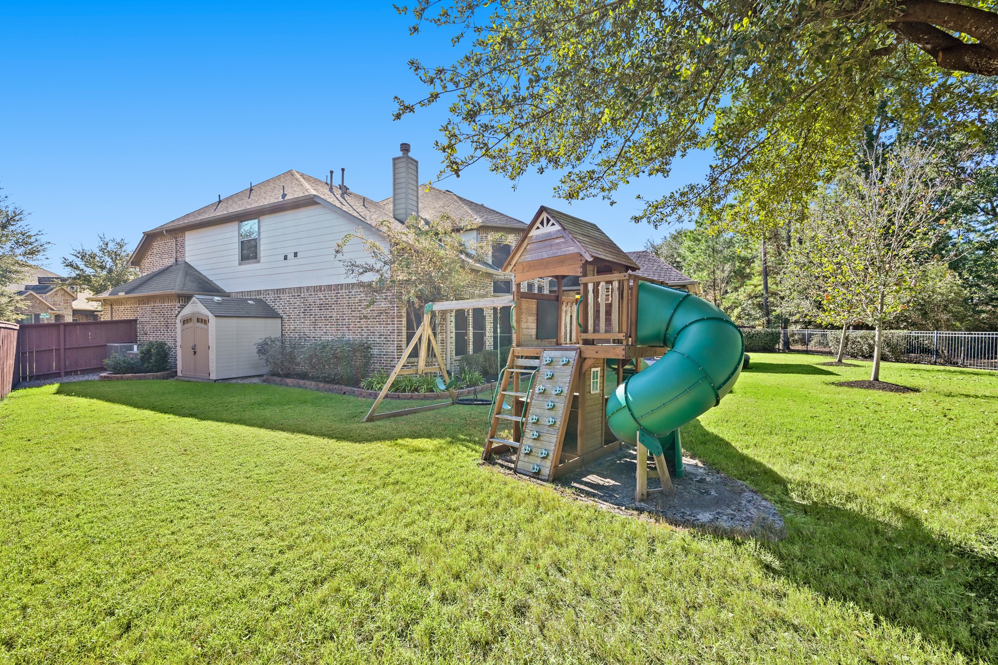 25202 Quiet Ledge Porter, TX 77365 - Photo 38 of 49 a view of a house with a yard potted plants and a large tree
