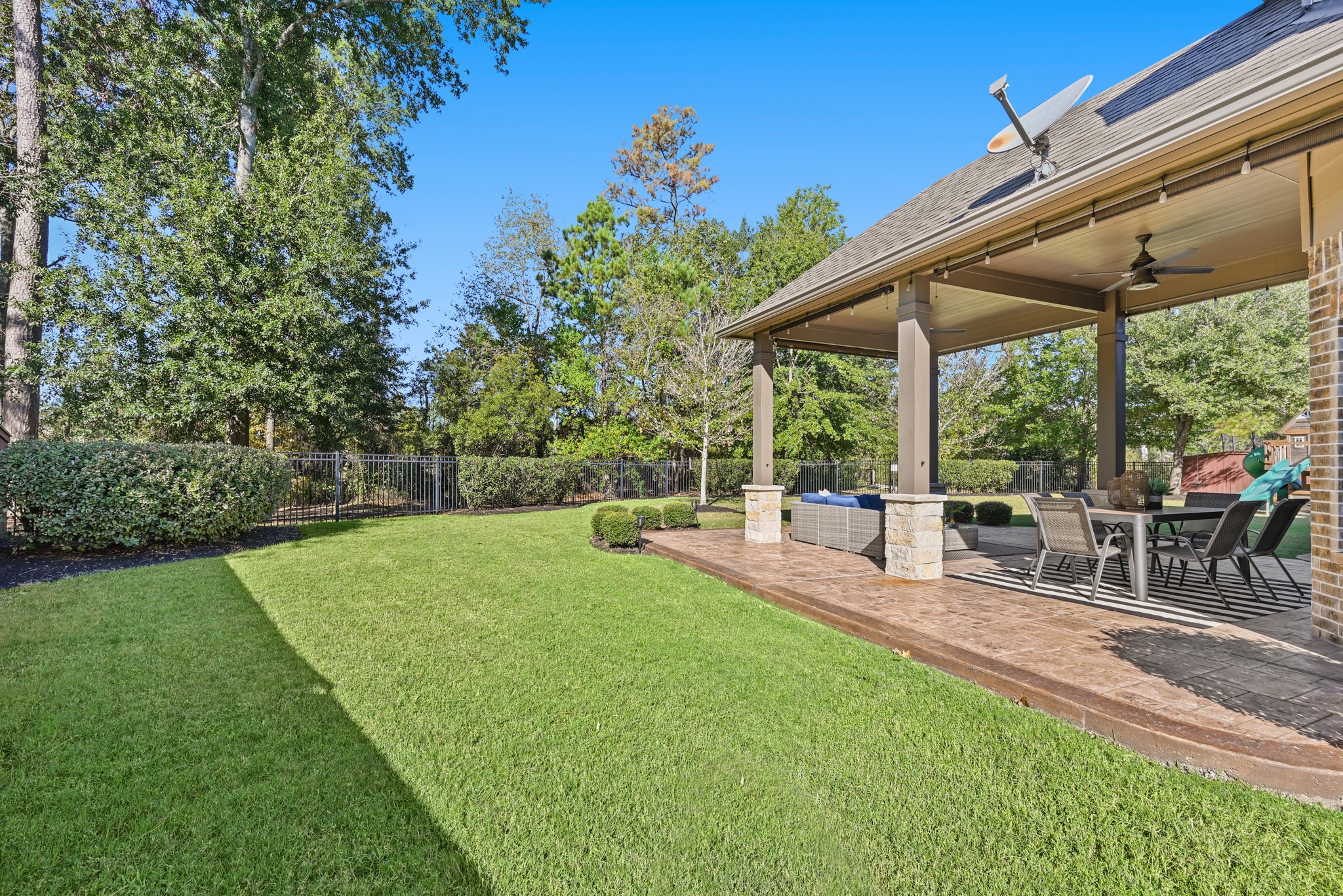 25202 Quiet Ledge Porter, TX 77365 - Photo 45 of 49 a view of a patio with a table and chairs under an umbrella