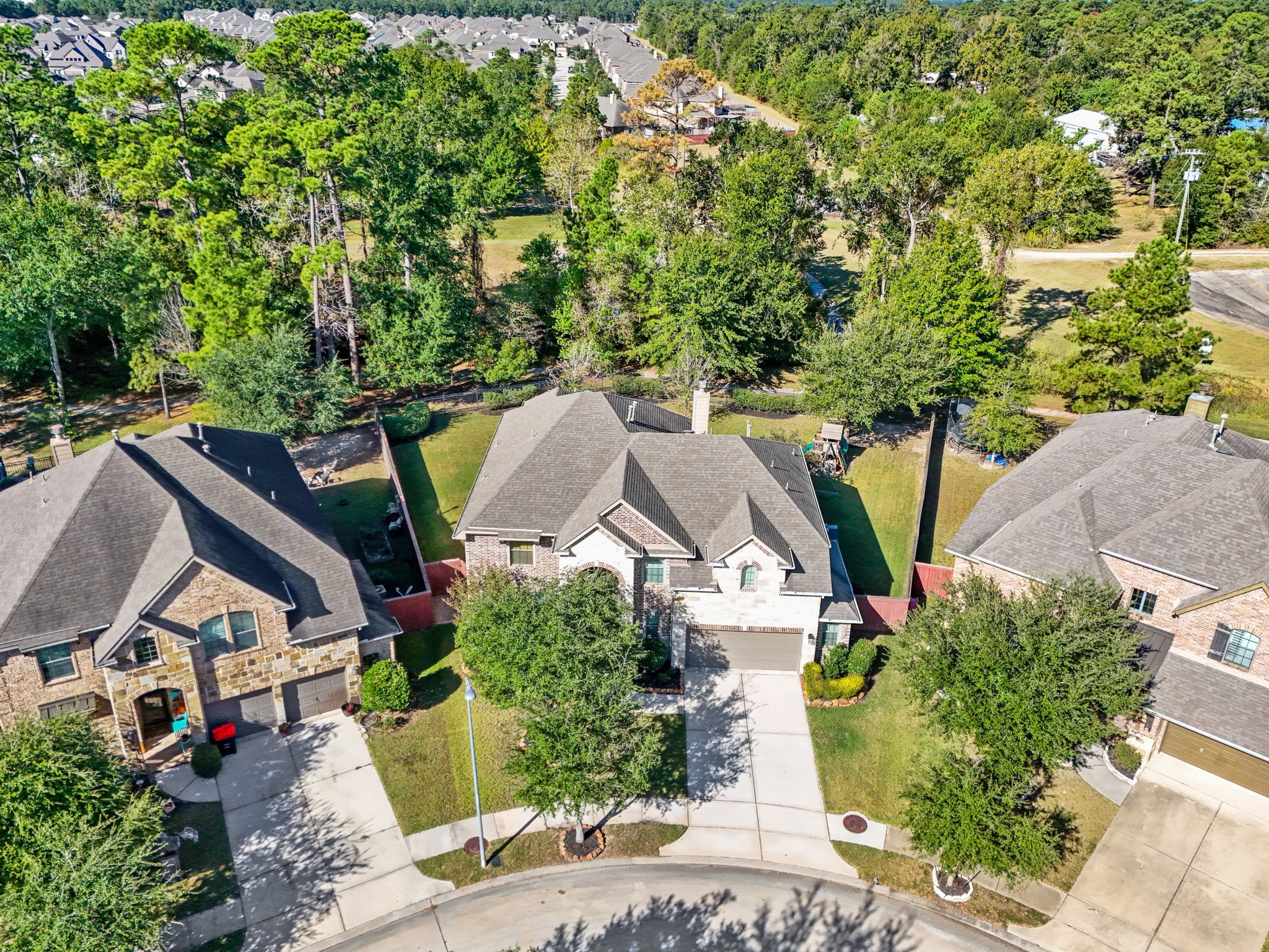 25202 Quiet Ledge Porter, TX 77365 - Photo 46 of 49 an aerial view of multiple houses with yard