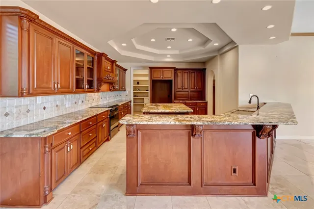 a living room with hard wood floors and a fireplace