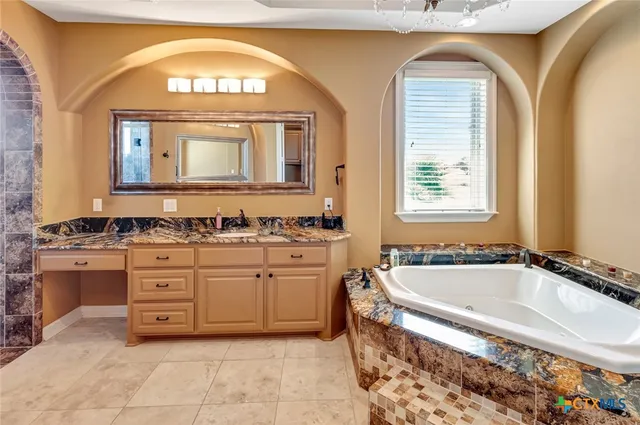 a bathroom with a bathtub and shower