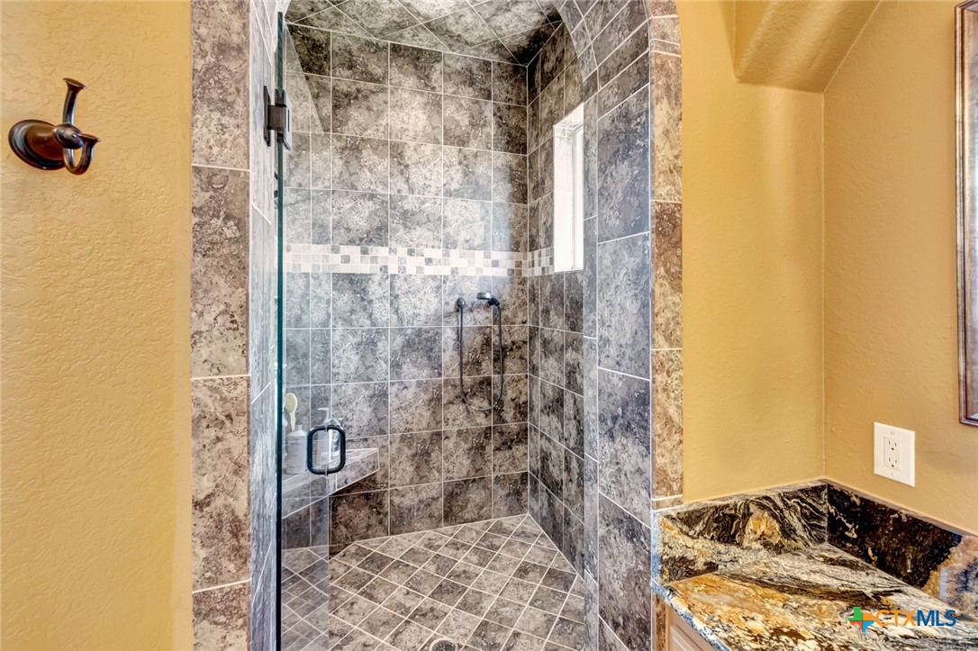 48 Post Oak Run Inez, TX 77968 - Photo 19 of 42 a bathroom with a bathtub and shower