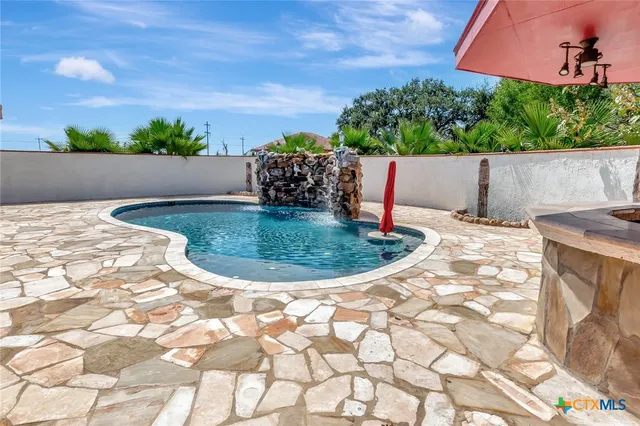 a view of a backyard with sitting area