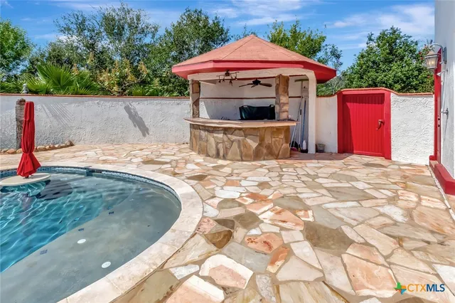a white toilet sitting next to a bathroom sink