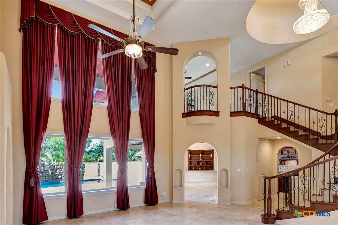 48 Post Oak Run Inez, TX 77968 - Photo 6 of 42 a view of staircase with railing and a chandelier