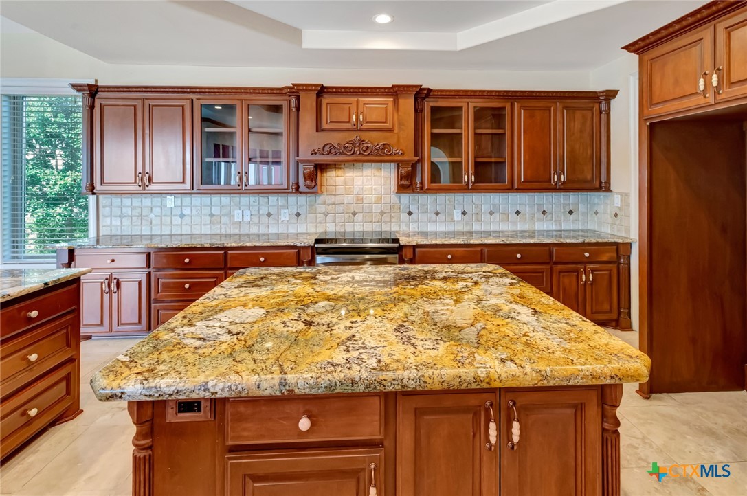 48 Post Oak Run Inez, TX 77968 - Photo 9 of 42 a kitchen with granite countertop sink and cabinets