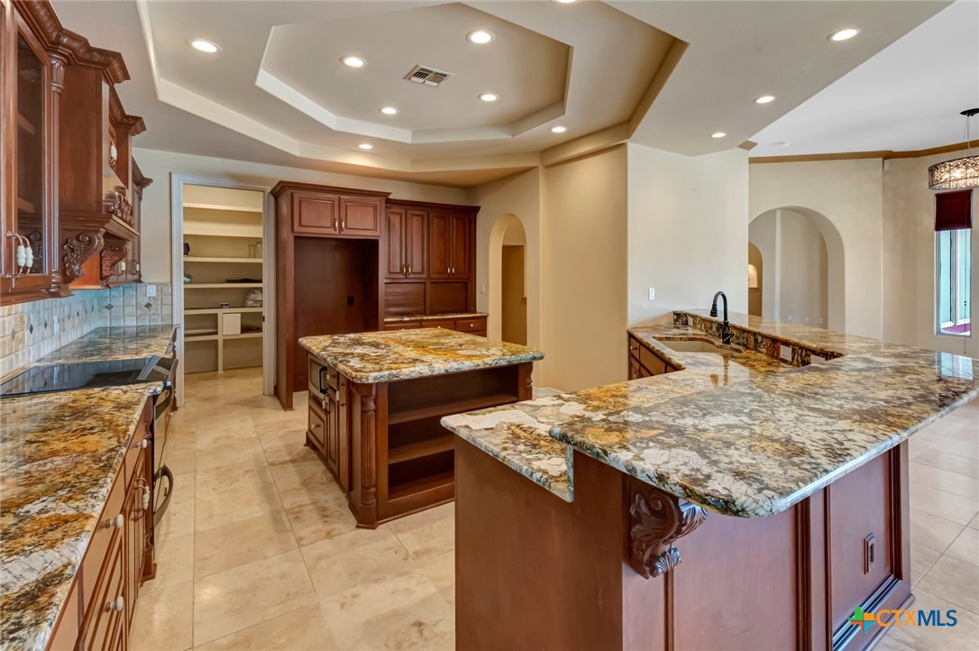 48 Post Oak Run Inez, TX 77968 - Photo 10 of 42 a kitchen with stainless steel appliances granite countertop a stove and a sink