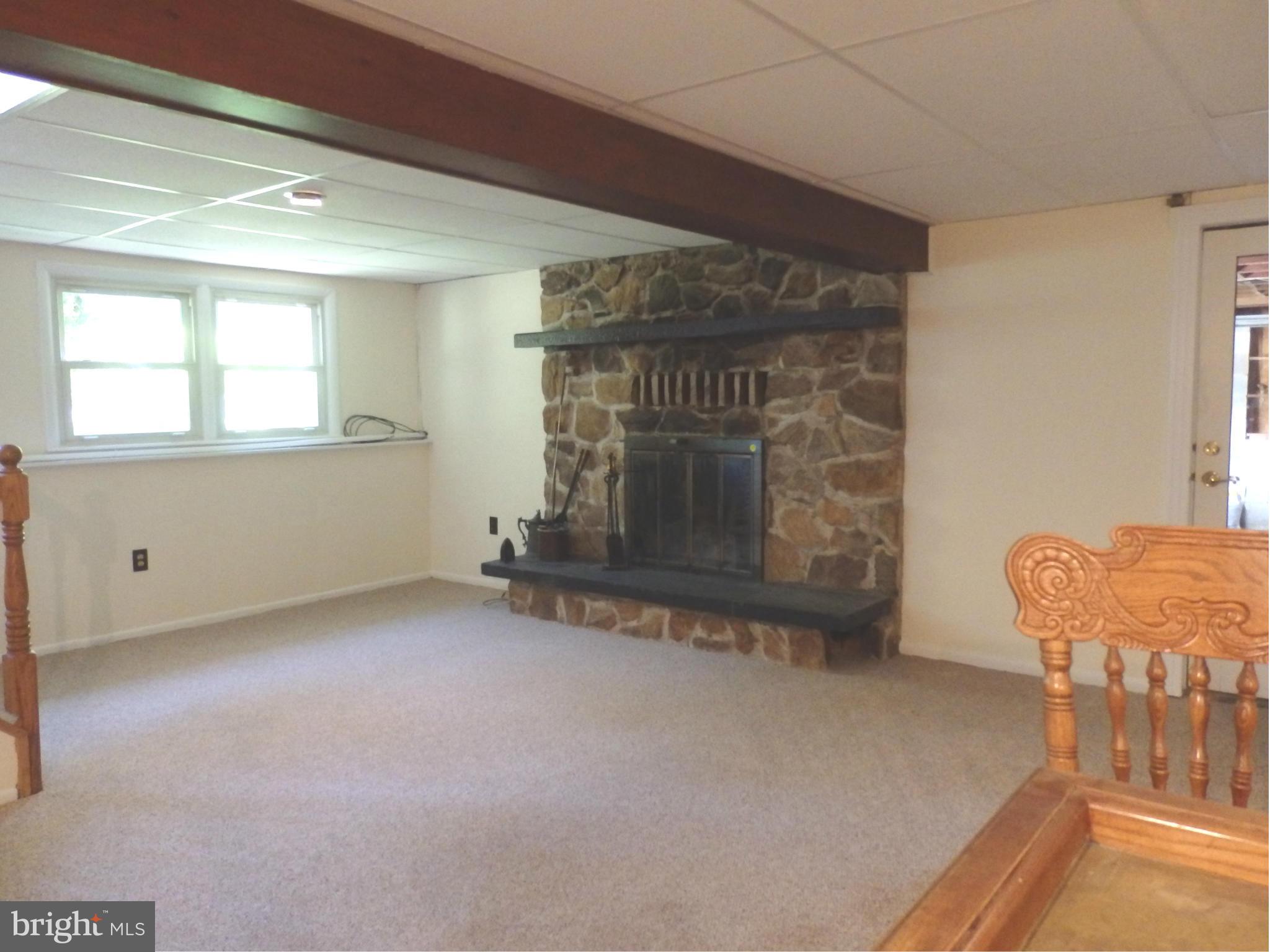 8607 Rocky Springs Road Frederick, MD 21702 - Photo 14 of 27 Family Room has stone fireplace