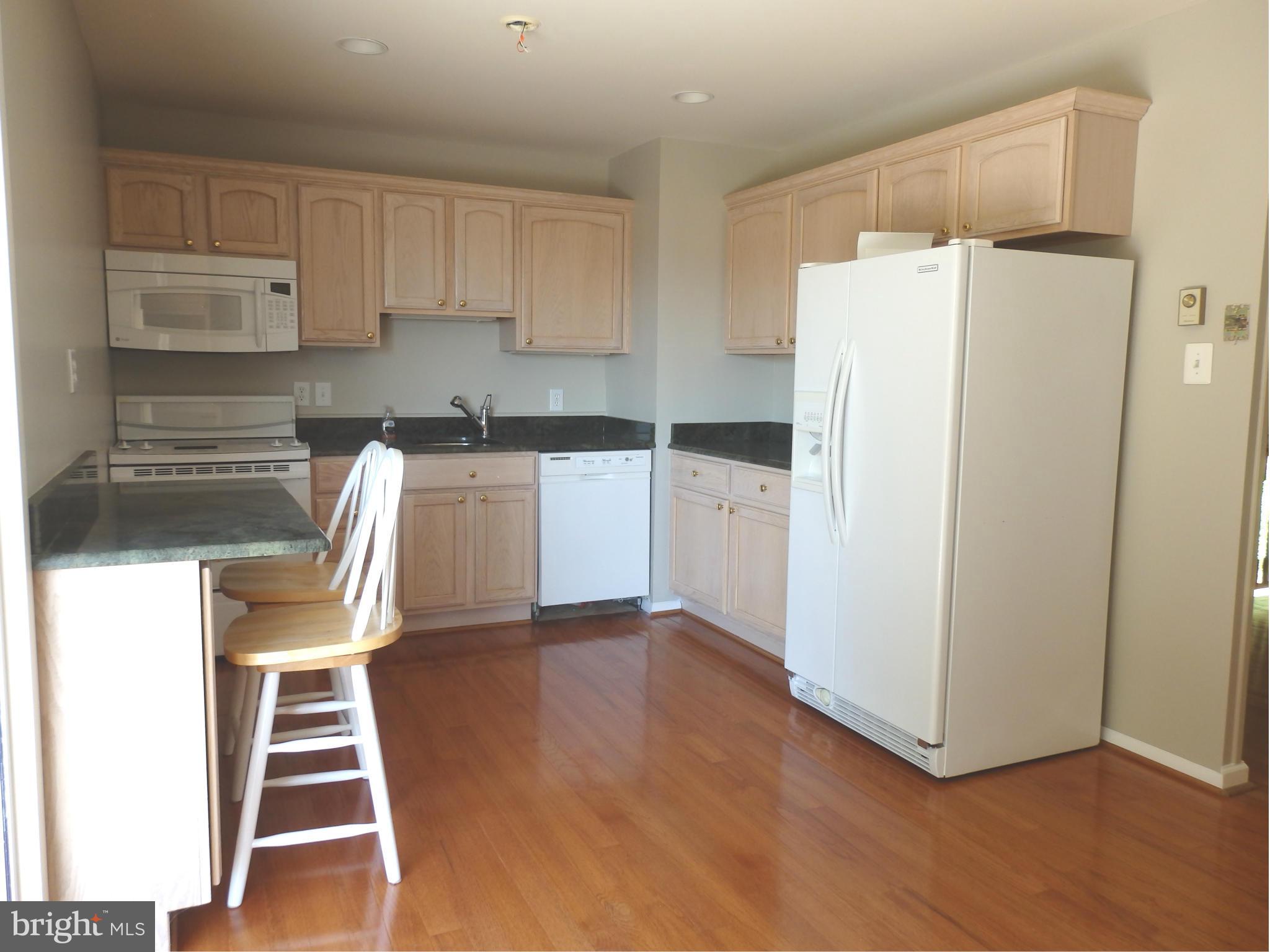 8607 Rocky Springs Road Frederick, MD 21702 - Photo 6 of 27 Kitchen has oak cabinets and granite counters