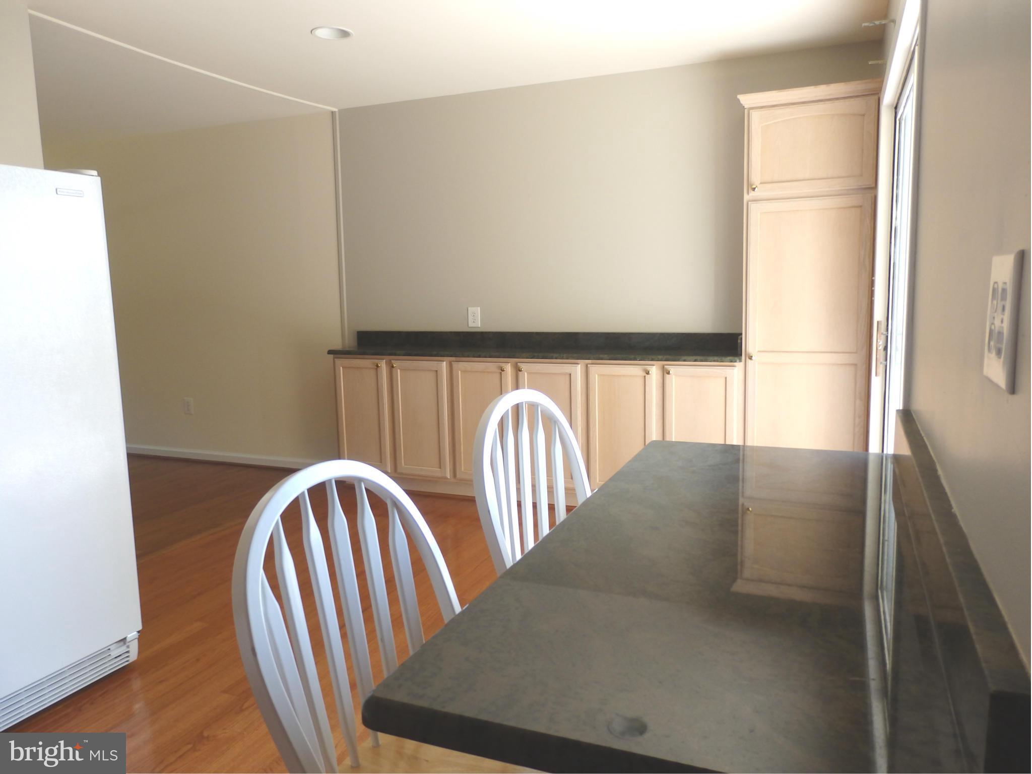 8607 Rocky Springs Road Frederick, MD 21702 - Photo 8 of 27 Breakfast bar with storage in kitchen