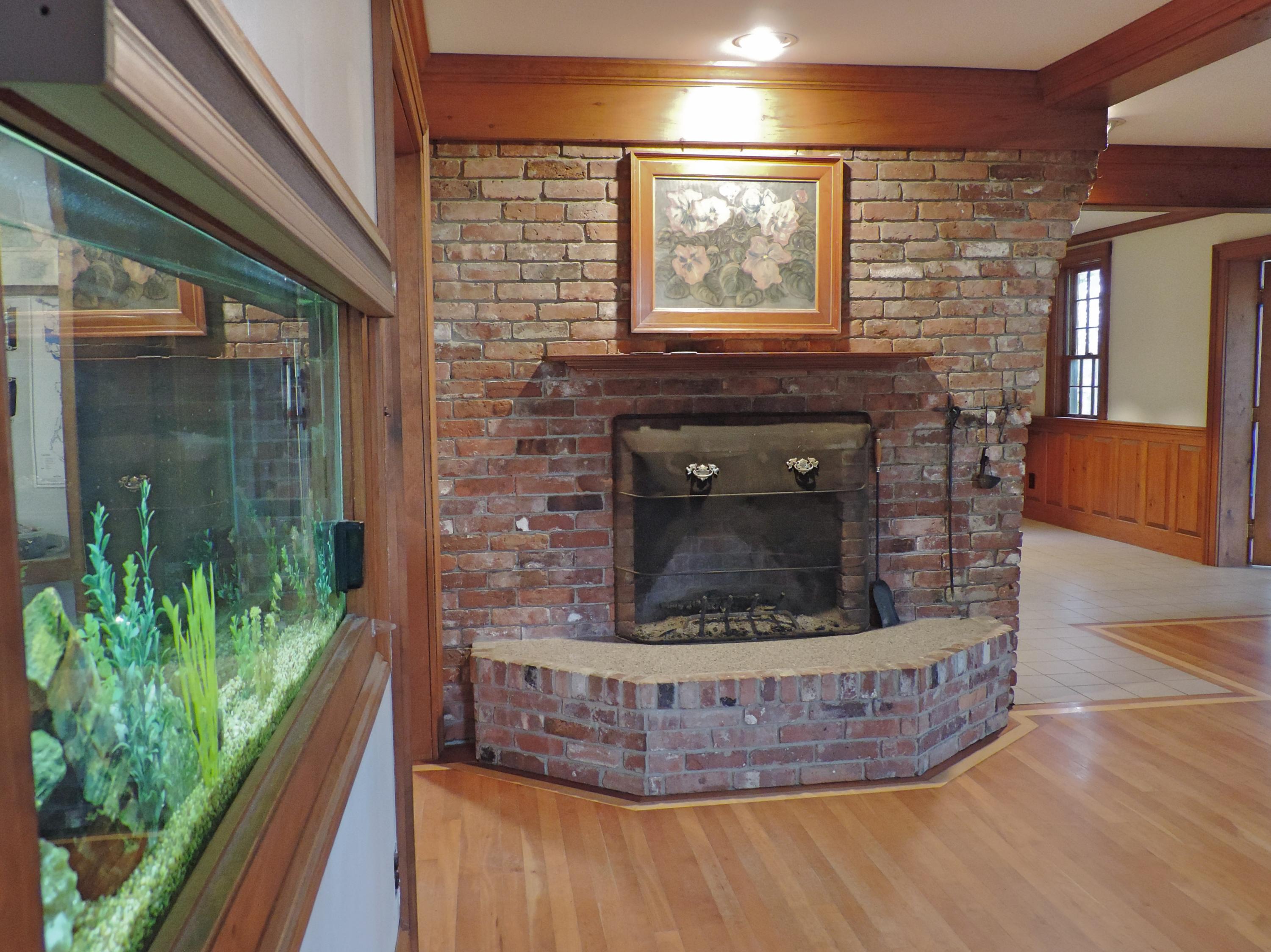 674 Goding Road Acton, ME 04001 - Photo 43 of 43 Fish Tank wall looking at Fireplace