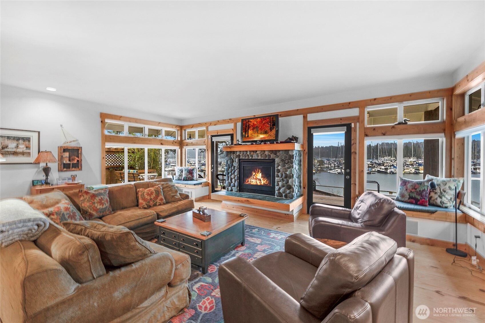 1 Pintail Road Port Ludlow, WA 98365 - Photo 12 of 36 a living room with furniture a large window and a fireplace