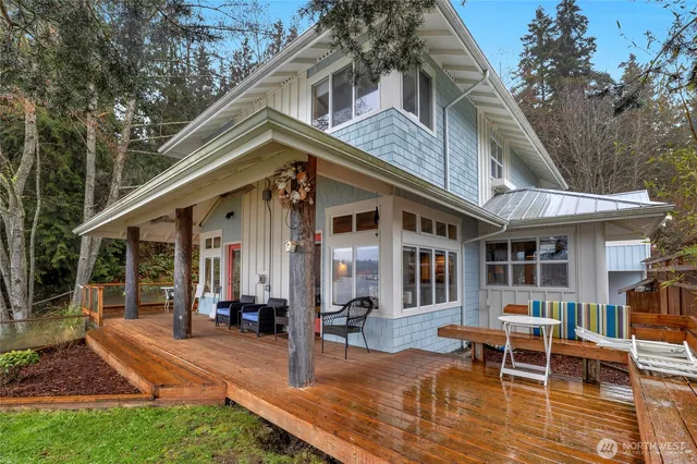 a view of a house with backyard porch and sitting area