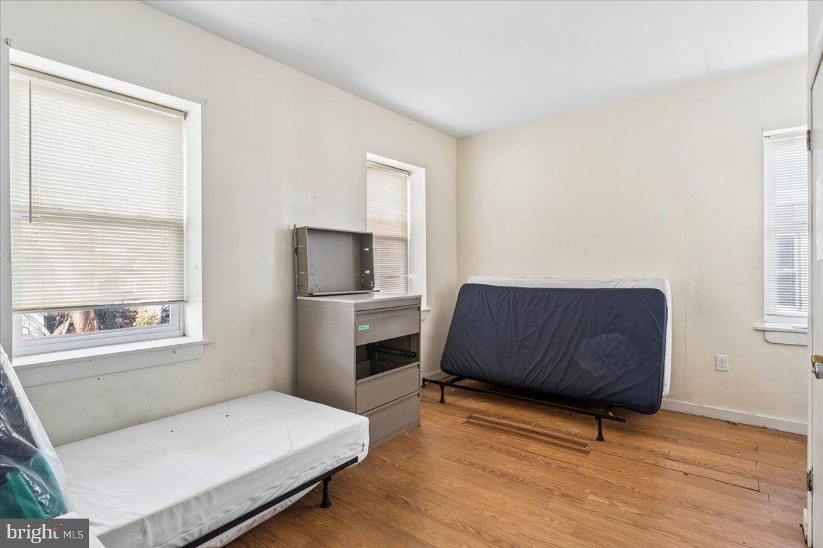 5205-07 Webster Street Philadelphia, PA 19143 - Photo 21 of 37 a living room with a bed furniture and a window